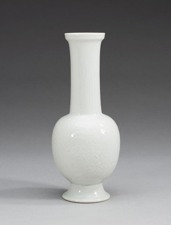 A white glazed vase, Qing dynasty with mark.