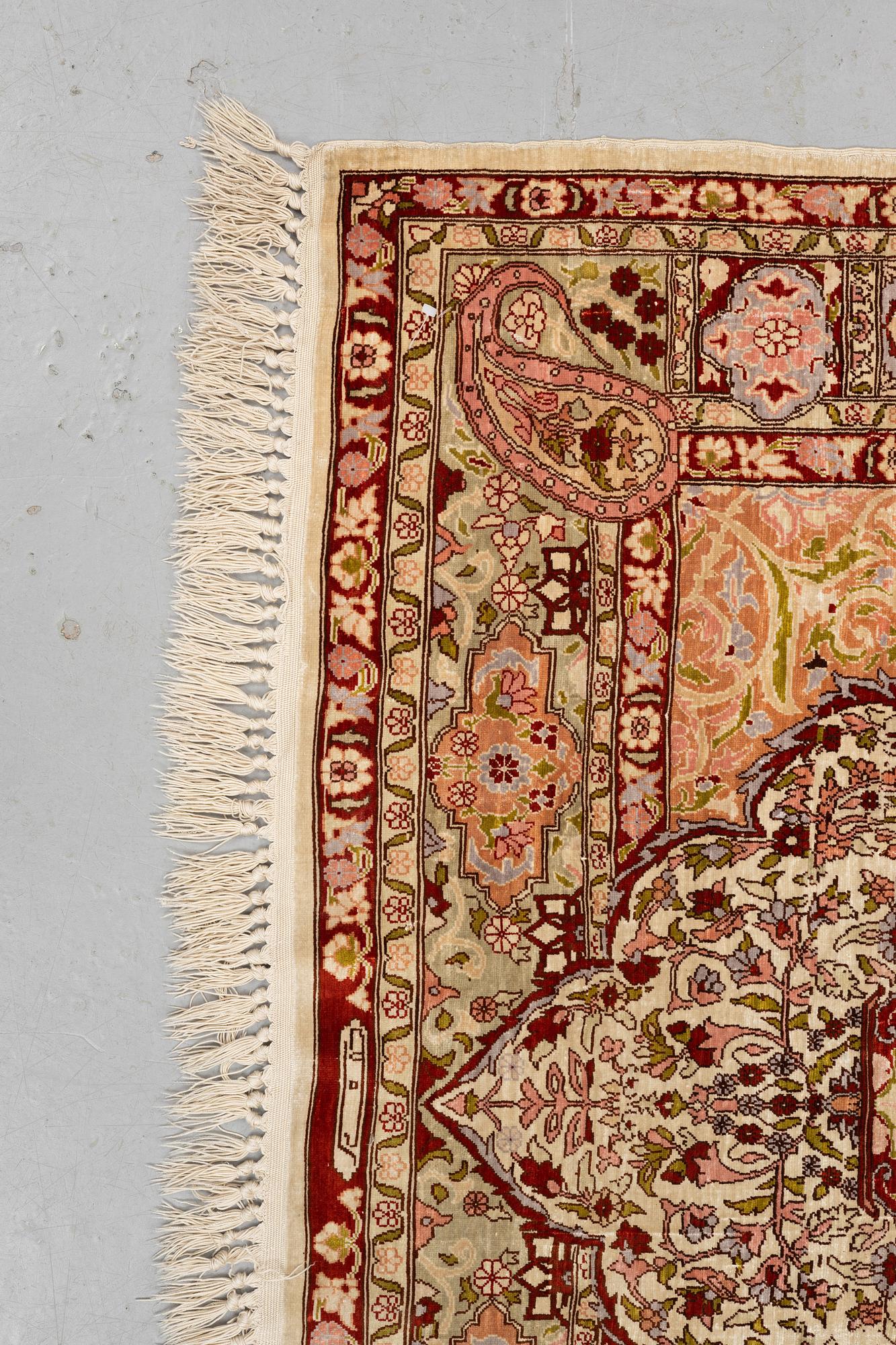 A rug, Old silk Hereke, ca 152 x 110 cm.