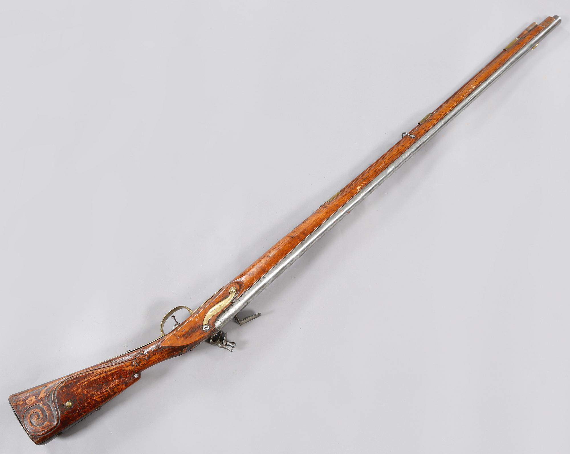 A flintlock rifle, 18th century.
