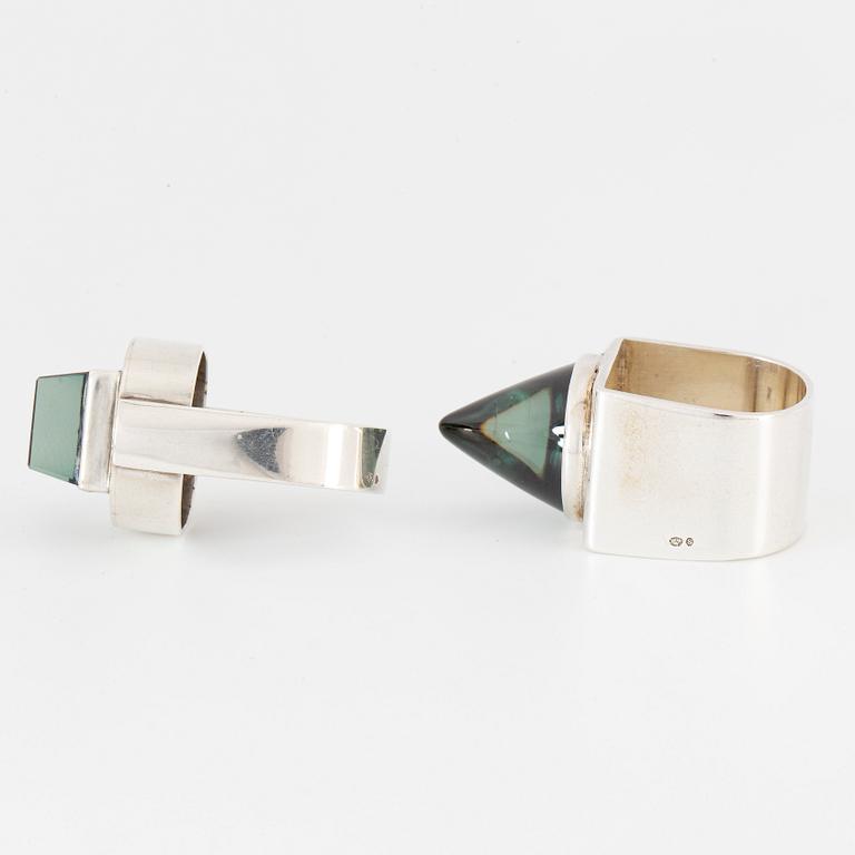 Silver and synthetic green spinel rings.