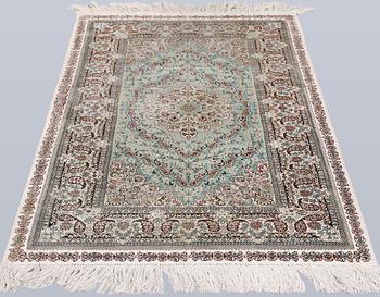 An Oriental silk rug, approx. 154 x 91 cm.