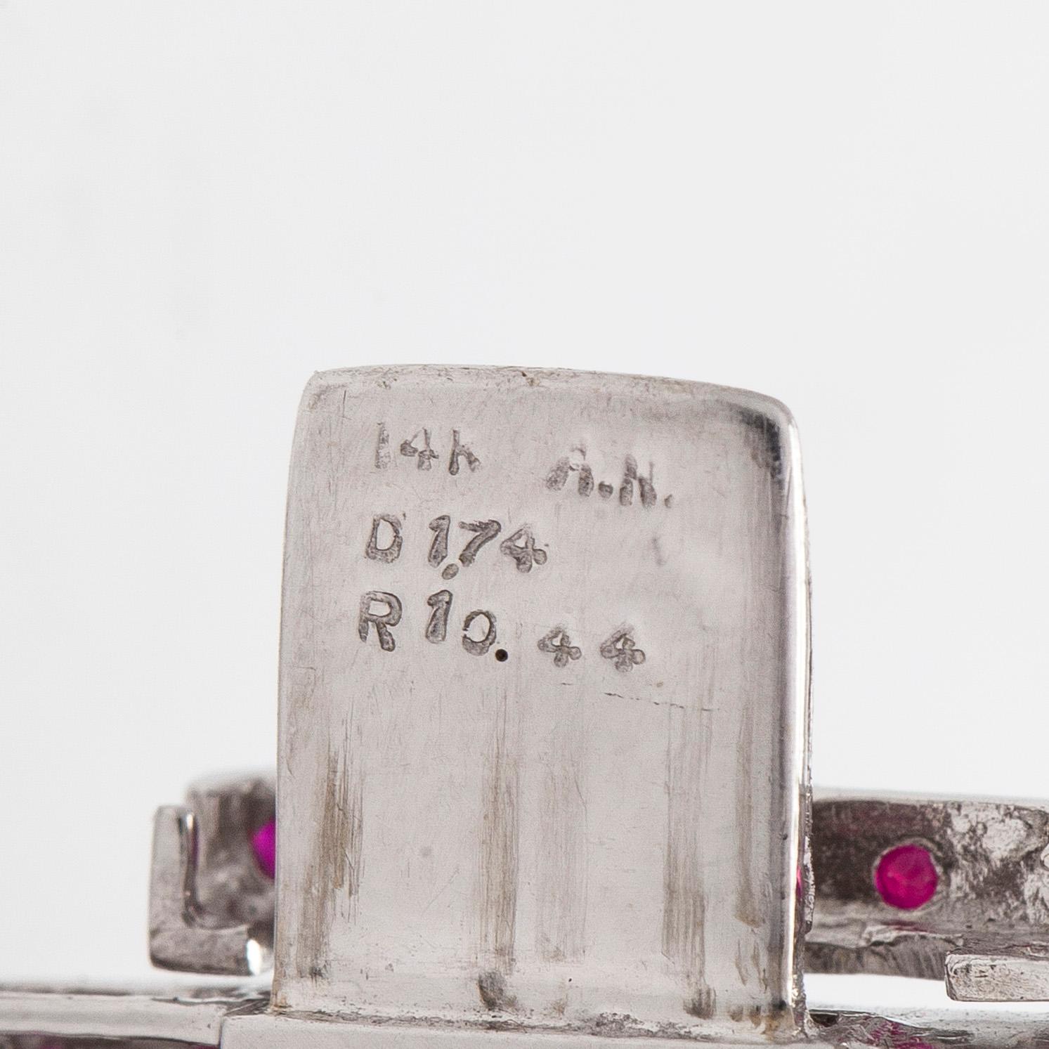 Bracelet in 14K white gold, with rubies and diamonds.
