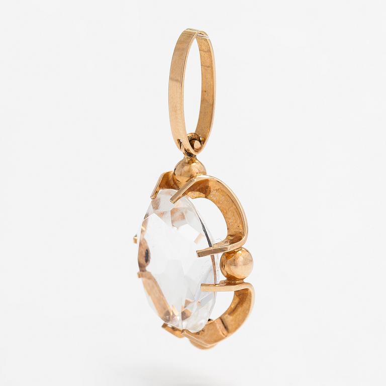 Elis Kauppi, A 14K gold pendant with a rock crystal. Kupittaan Kulta, Turku.