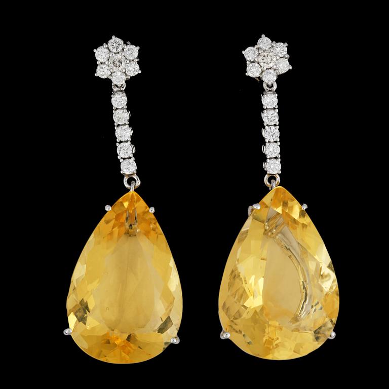 A pair of drop cut yellow opal and brilliant cut diamond earring, tot. app. 1.50 cts.