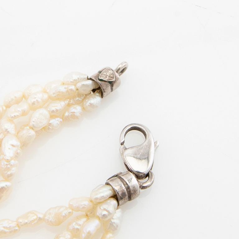 Tonino Lamborghini, Necklace of cultured pearls with a pendant of 18K gold, silver, and faceted citrines.