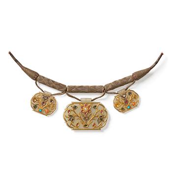 Three gold-inlaid and gem-set jade pendants, India, 19th century.