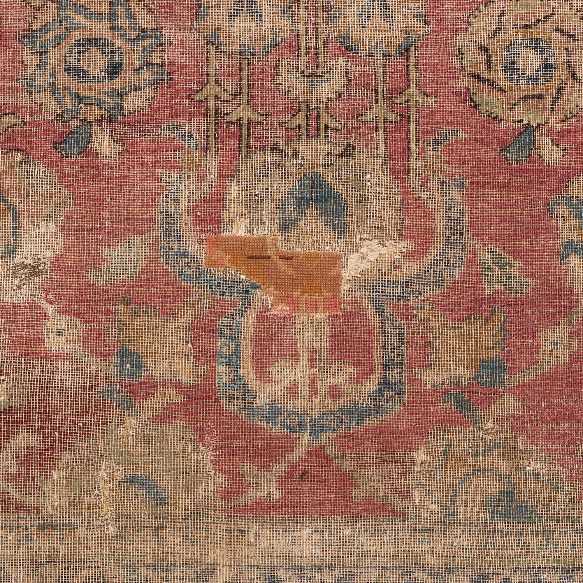 A safavid 'Spiral vine' Esfahan carpet, central persia, mid to second haft of the 17th century. Ca 562 x 231 cm.