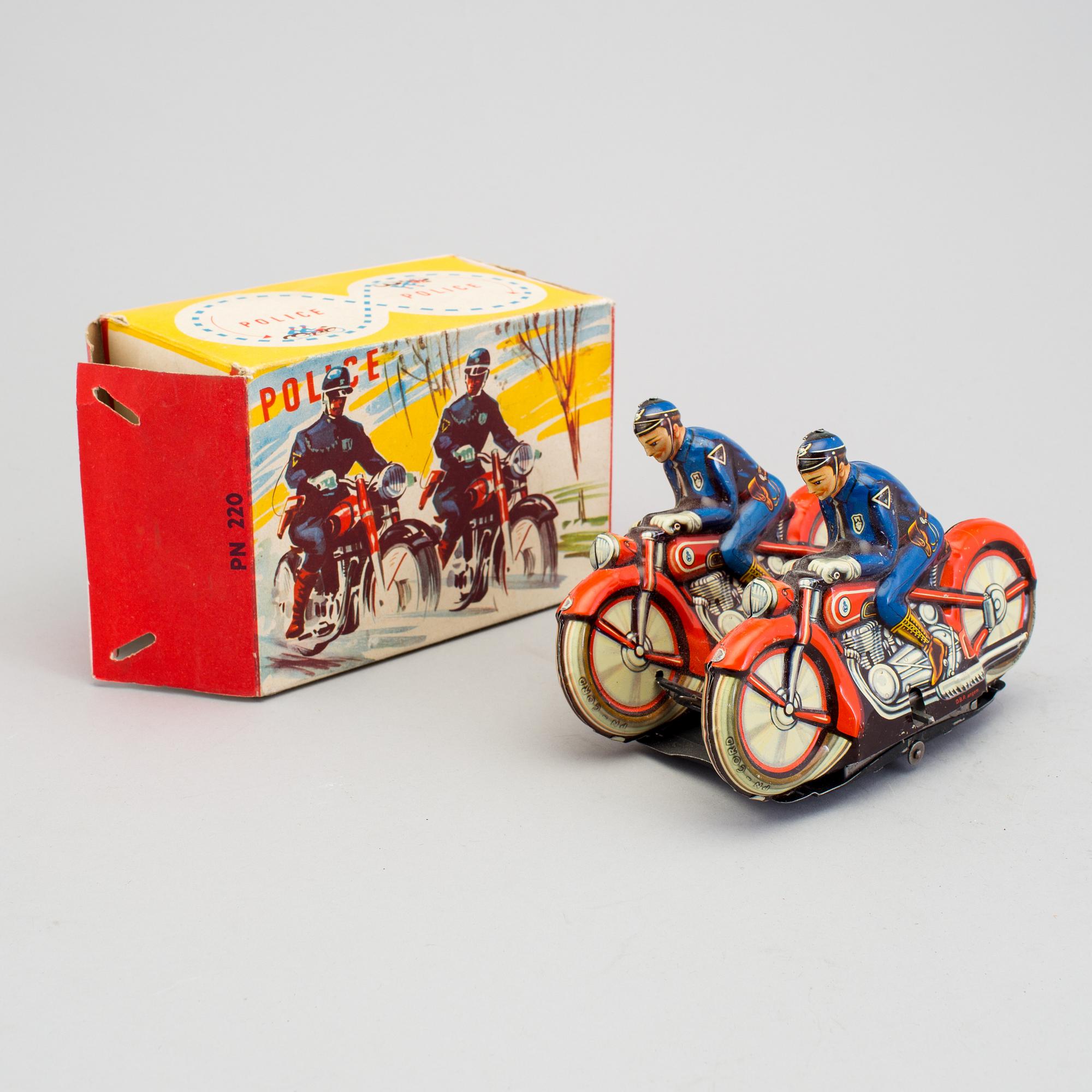 A tinplate synchronous motorcycle by Philipp Niedermeier, Germany, 1950s.