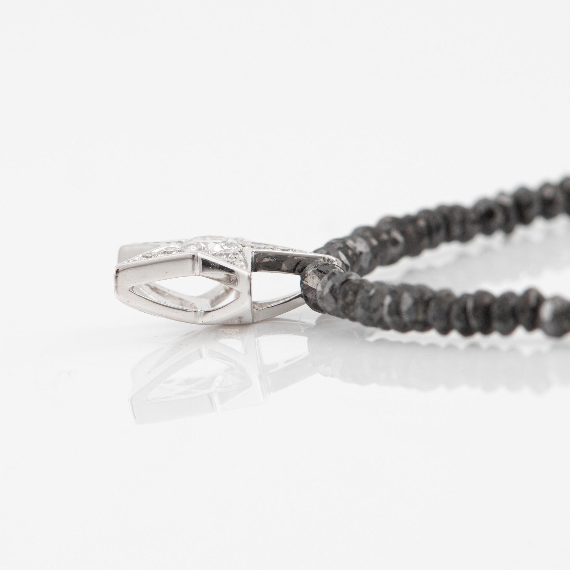 Necklace, Atelier Ajour, black diamonds with a star pendant set with brilliant-cut diamonds.