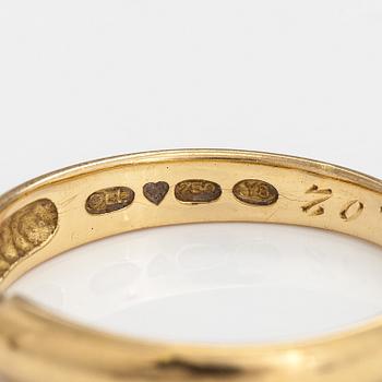An 18K gold ring with a ca. 0.10 ct diamond. Finland 2000.