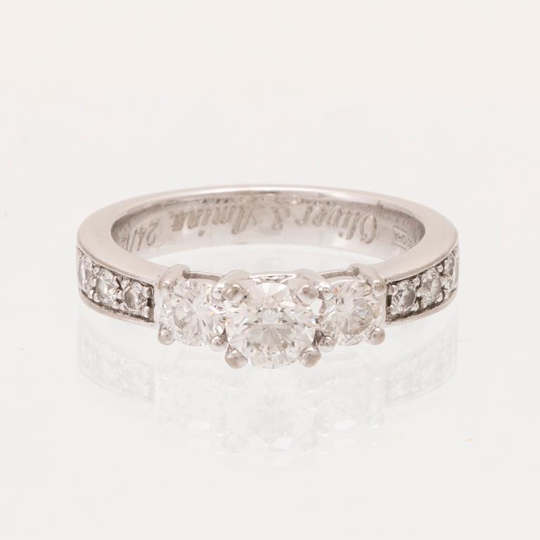 An 18K white gold ring set with round brilliant cut diamonds.