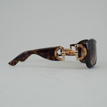 A pair of Gucci GG2970/S sunglasses with case.