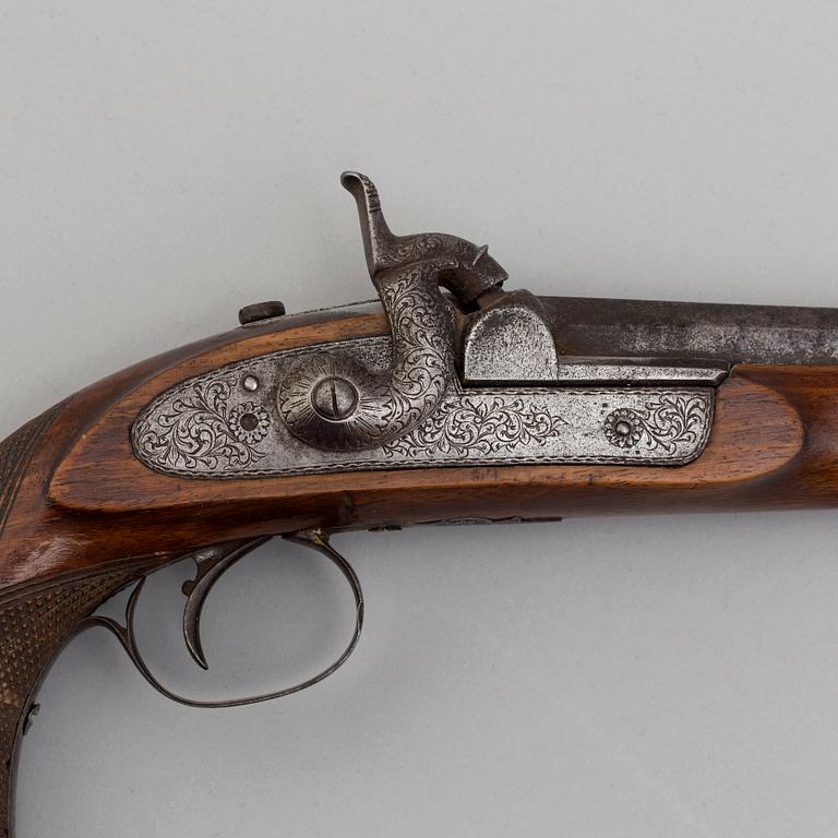 A mid 19th century percussion pistol.