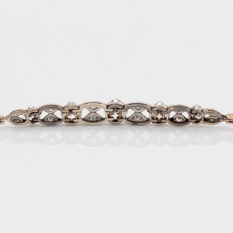 An 18K gold and platinum bracelet set with old- and eight-cut diamonds.