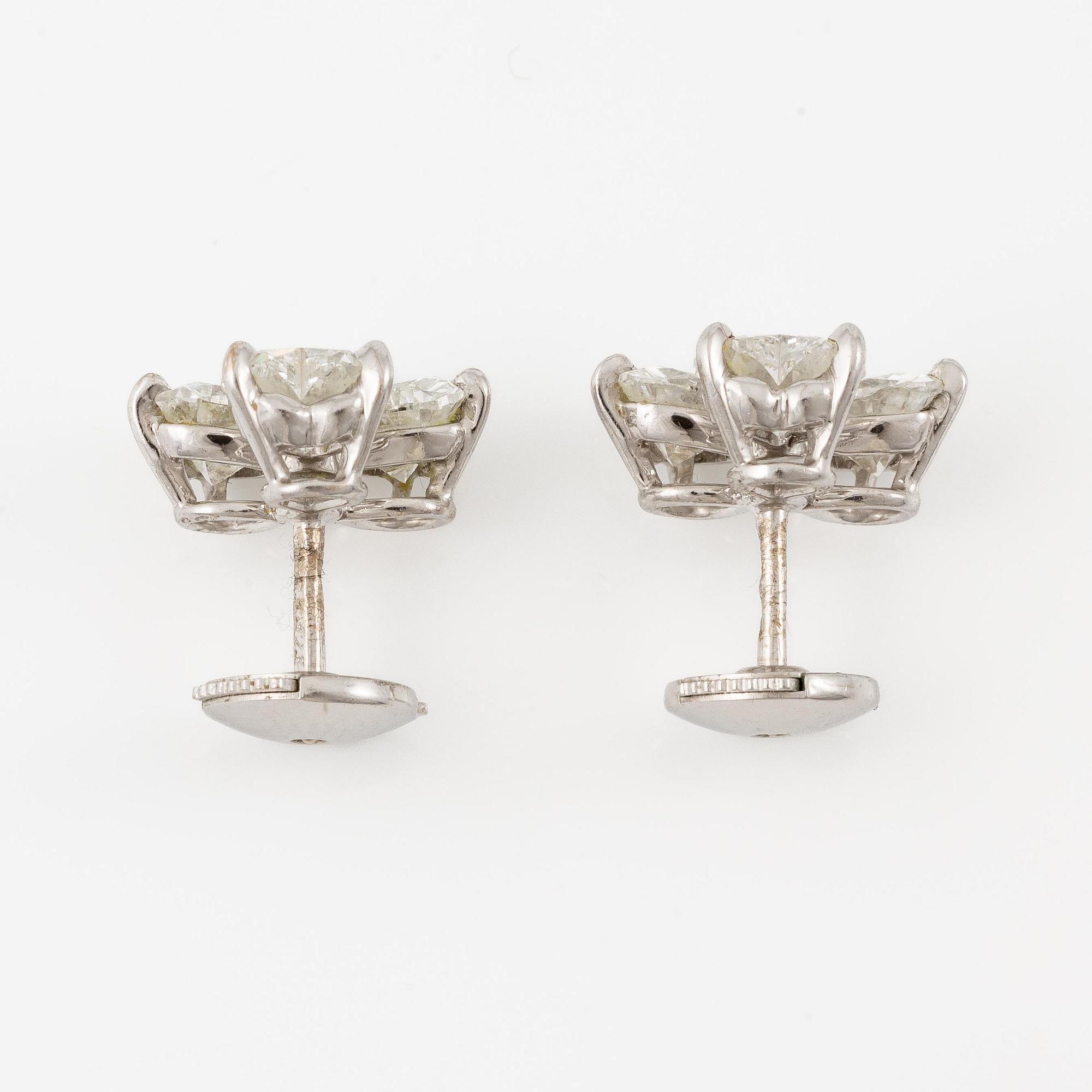 A pair of Cartier earrings in 18K white gold with six heart-shaped brilliant-cut diamonds.