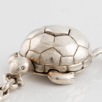 Hermès, silver turtle key charm.