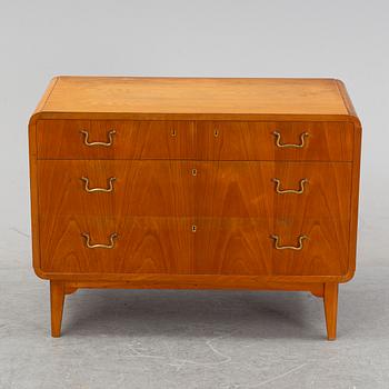 An elm wood venered chest of drawers mid 20th century.