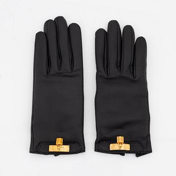 Hermès, a pair of black 'Kelly' kidskin and lambskin gloves, french size 7.