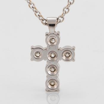 An 18K white gold cross pendant set with round brilliant-cut diamonds with a total weight of ca 1.20 cts.