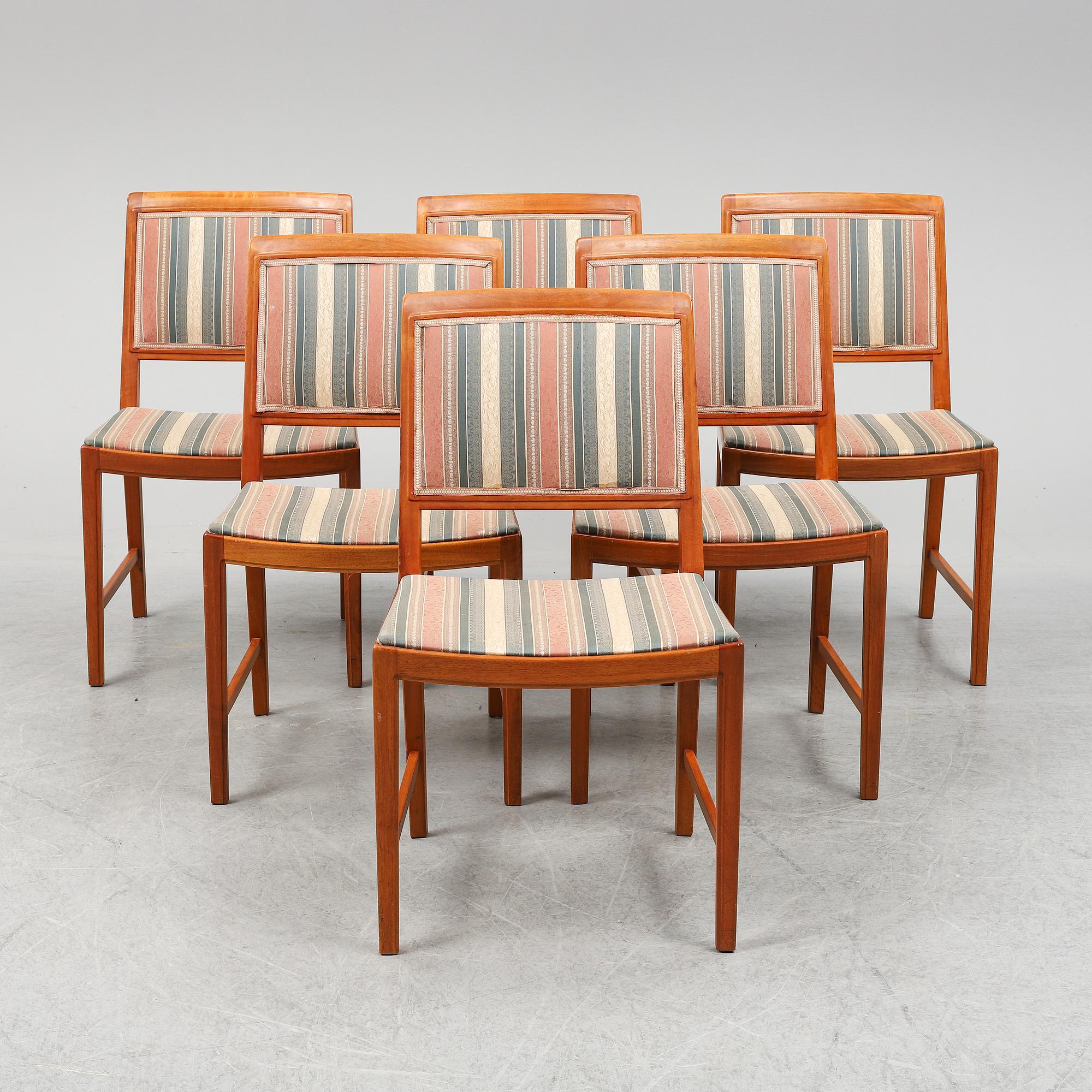 BERTIL FRIDHAGEN, a seven  piece walnut dining suite from Bodafors.