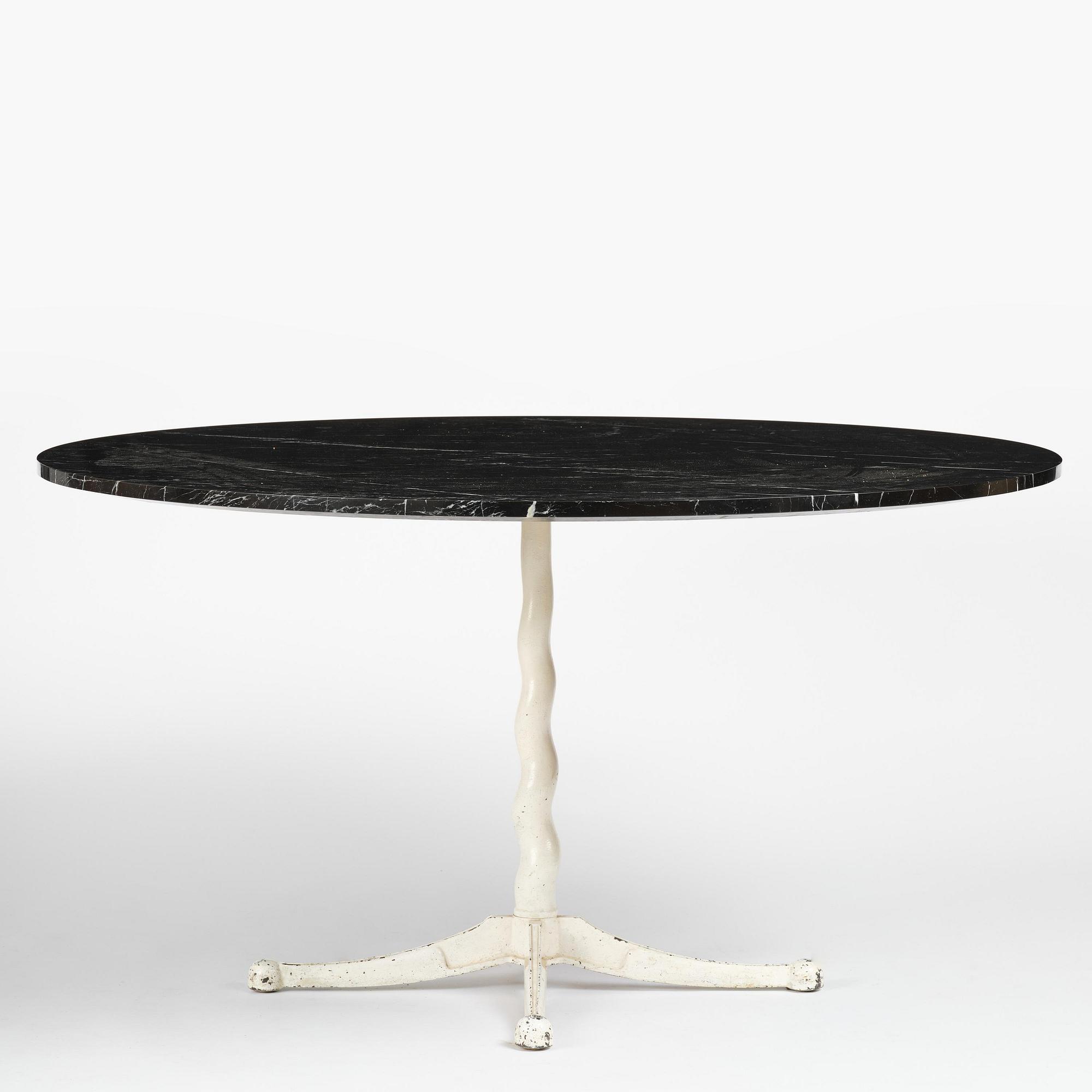 Josef Frank, attributed to, a cast iron table with marble top, Firma Svenskt Tenn, Sweden, 1950s.