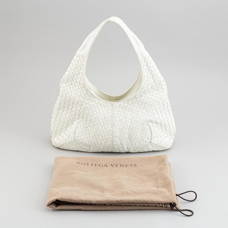 Bottega Veneta, a white intrecciato leather hobo bag.