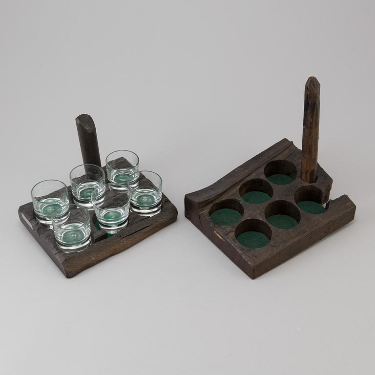 two whiskey stand made by wood from the Riksvasa ship with 6 glasses by Kosta in the 20th century.