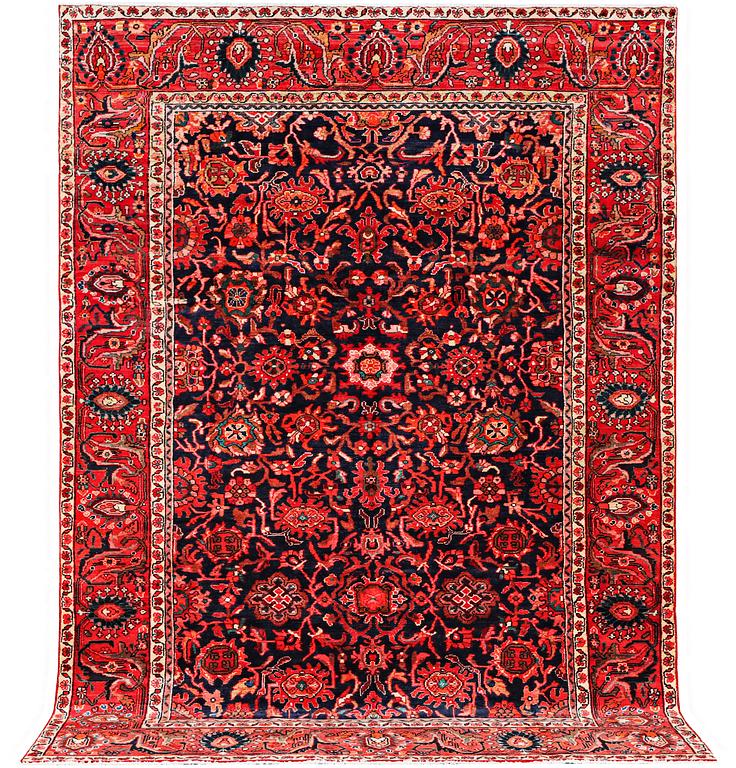 An oriental carpet, c. 305 x 220 cm.