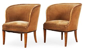 A pair of Nordiska Kompaniet 'Bellman' elm armchairs attributed to Axel Einar Hjorth, Sweden 1929-30.