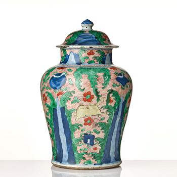 A pair of Transitional Wucai jars, 17th Century.