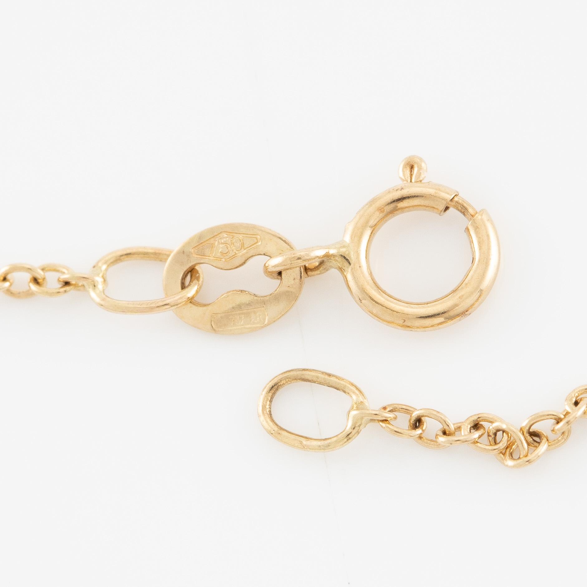 Collier 18K guld med briljantslipade diamanter.
