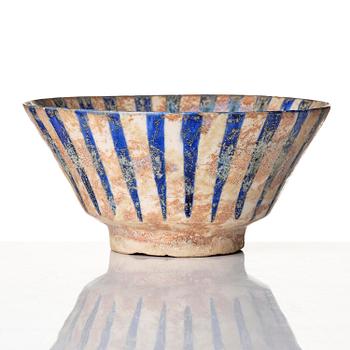 A cobalt glazed radila design pottery bowl, Persia (Iran), 12th/13th century.