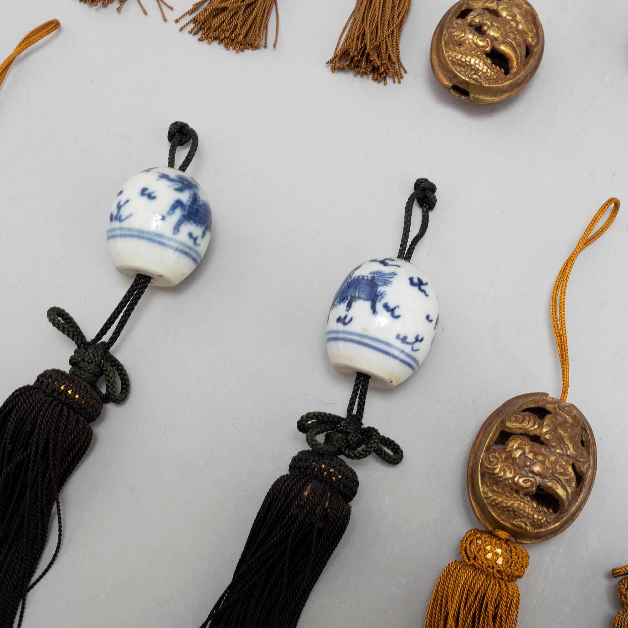 Eight (6+2) tassles, porcelain and bronze, Japan, 20th century.