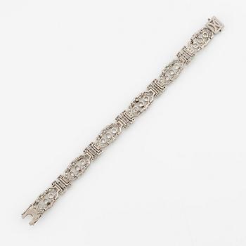 A platinum bracelet with round brilliant-and eight-cut diamonds.