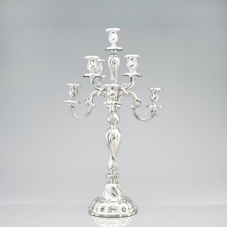 A pair of eight-light Louis XV-style silver candelabra, mark of Hermann Julius Wilm, Berlin, circa 1900.