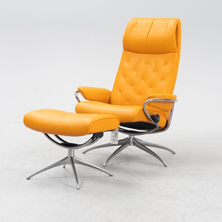 A 'London' stressless easy chair with foot stool, Norway.