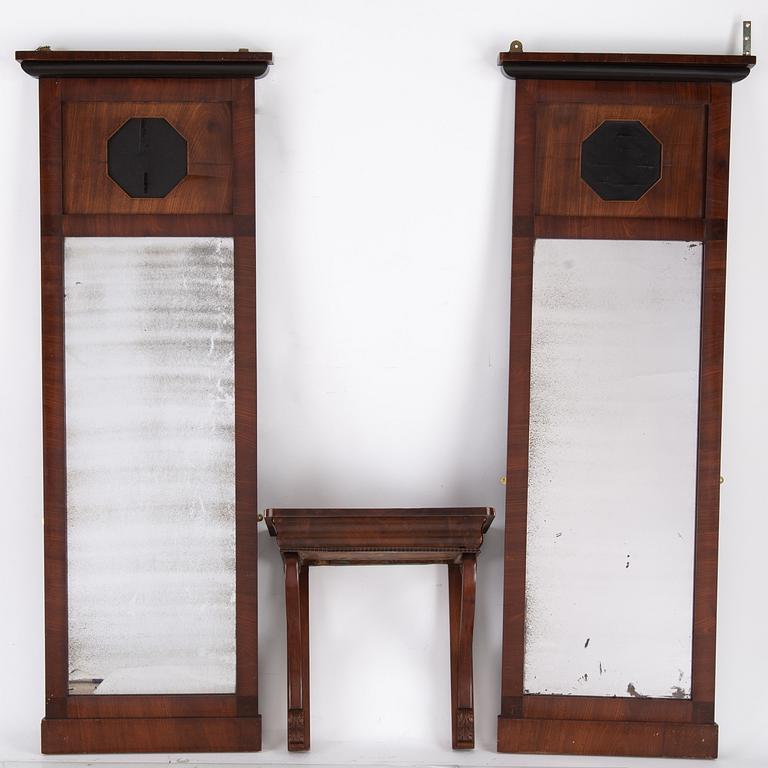 A pair of Biedermeier mahogany mirrors and one console table, 19th century.