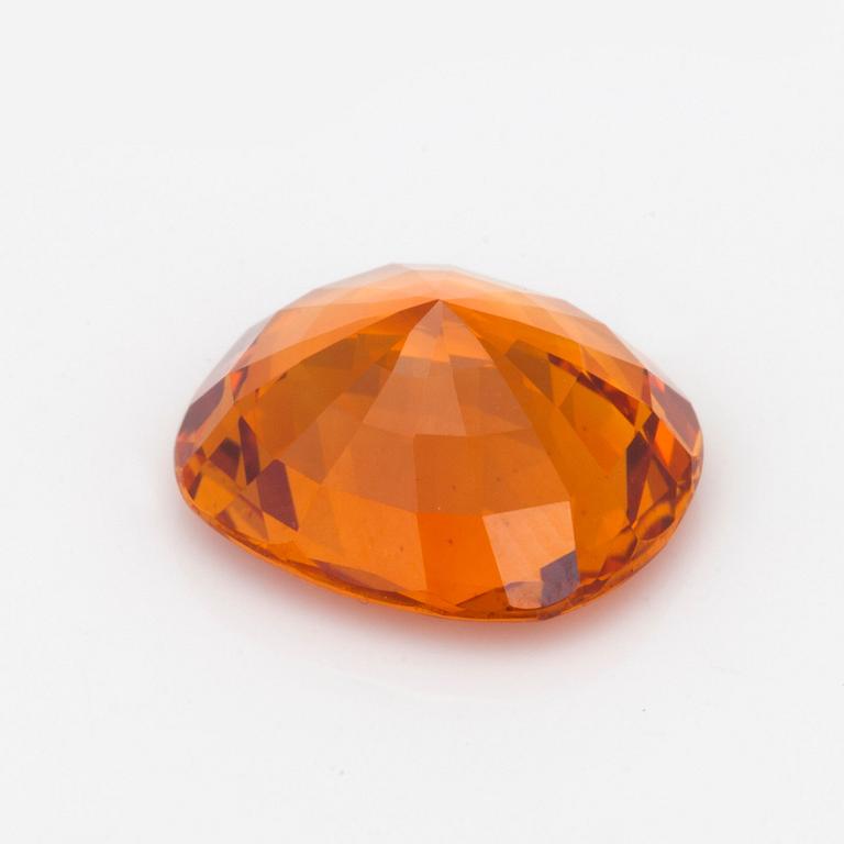 A 7.98 ct yellow-orange sapphire.