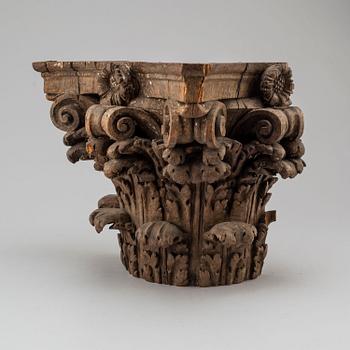 An 18th century carved wood corinthian capital.
