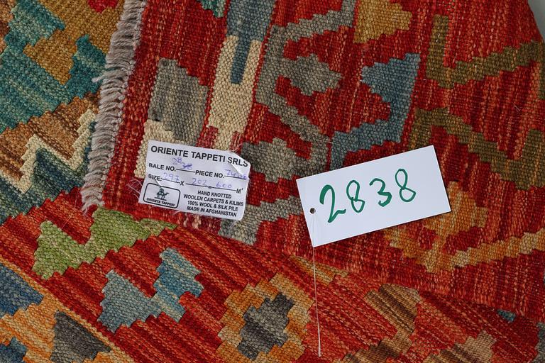 A carpet, kilim, ca 297 x 202 cm.