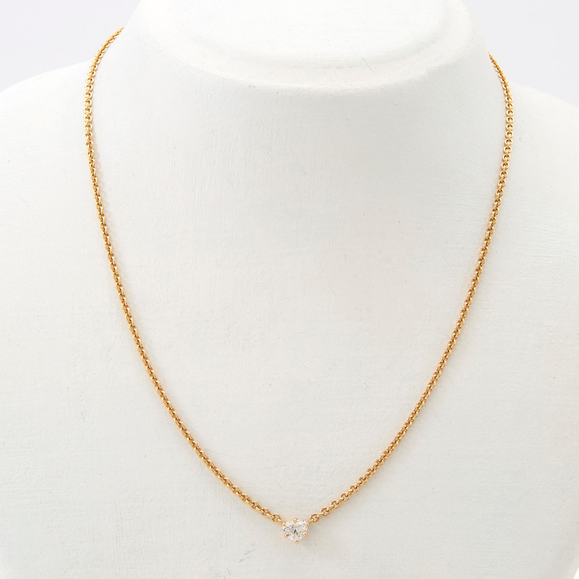 Necklace, 18K gold with heart-shaped diamond.