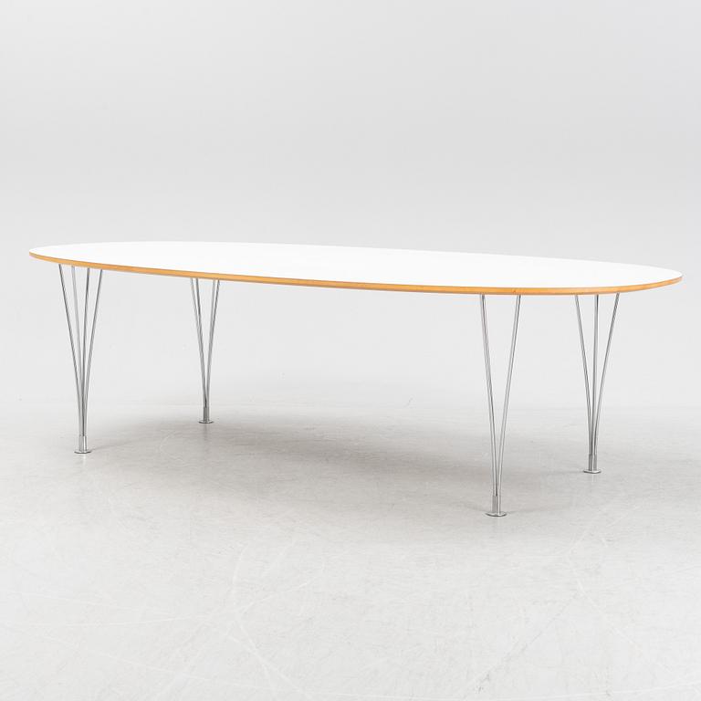 A Super ellpitical dining table, by Bruno Mathsson and Piet Hein for Fritz Hansen dated 2008.