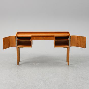 A 1940's table with pouf.