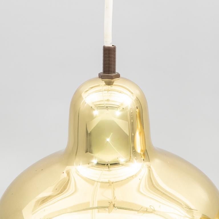 Alvar Aalto, a pair of "Golden Bell" brass pendant lamps, for Artek, Finland, model "A330S".
