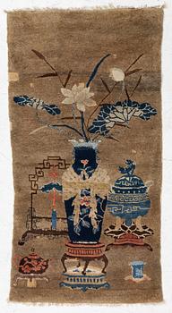 A Chinese antique rug, c. 122 x 64 cm.