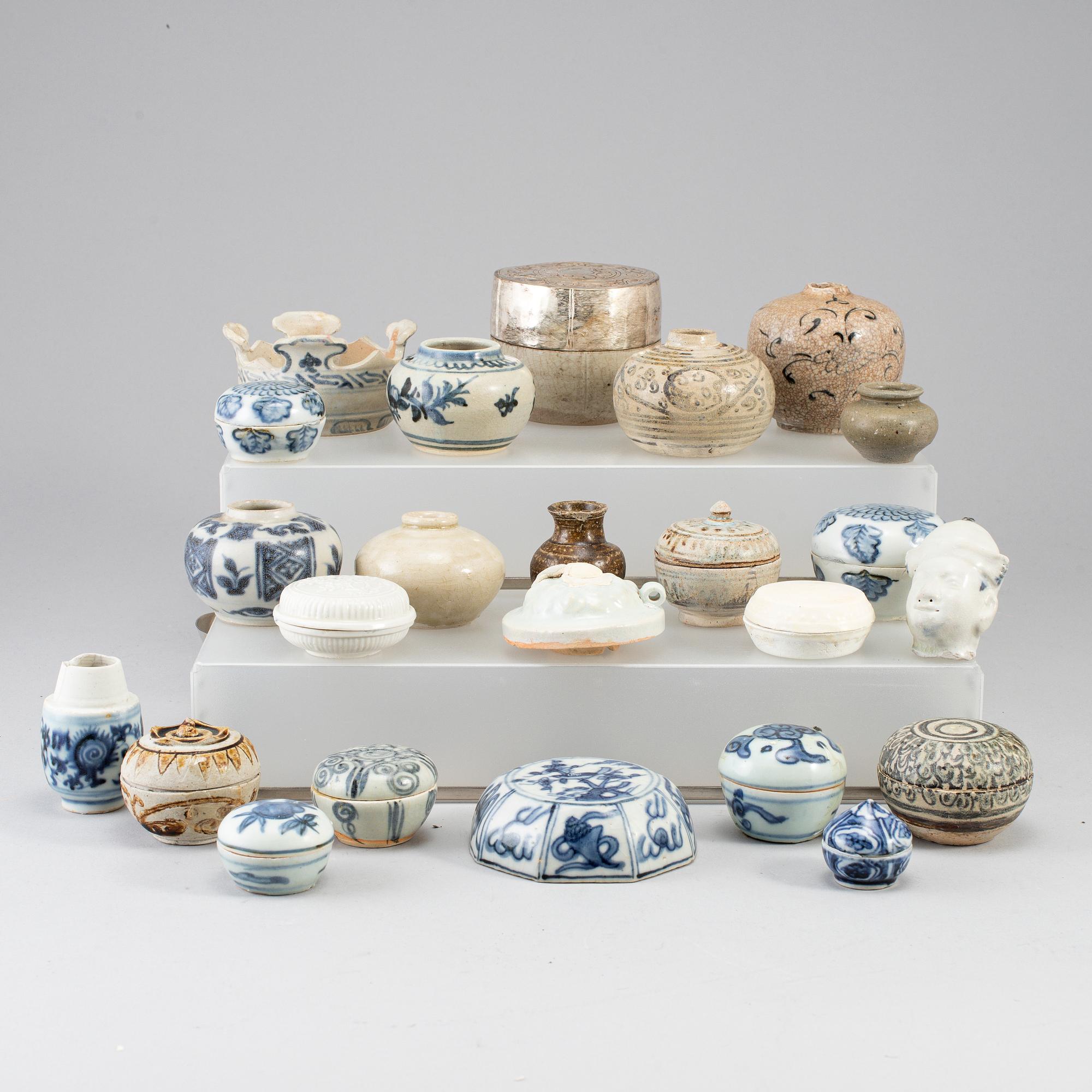 A group of 24 Southeast asian ceramic jars and boxes, 18-19th century.