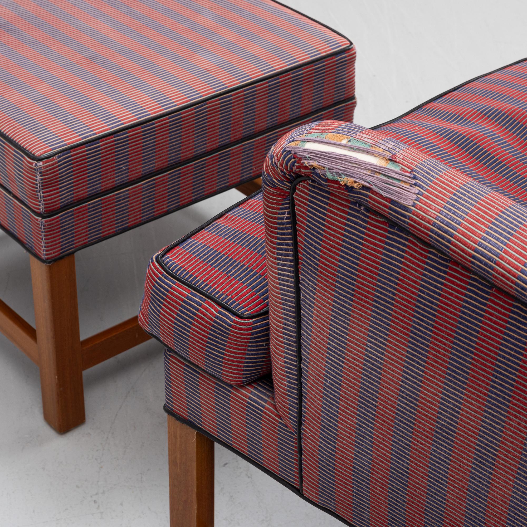 Kaare Klint, a pair of model 6212 armchairs with ottomans, Rud Rasmussen, Denmark.