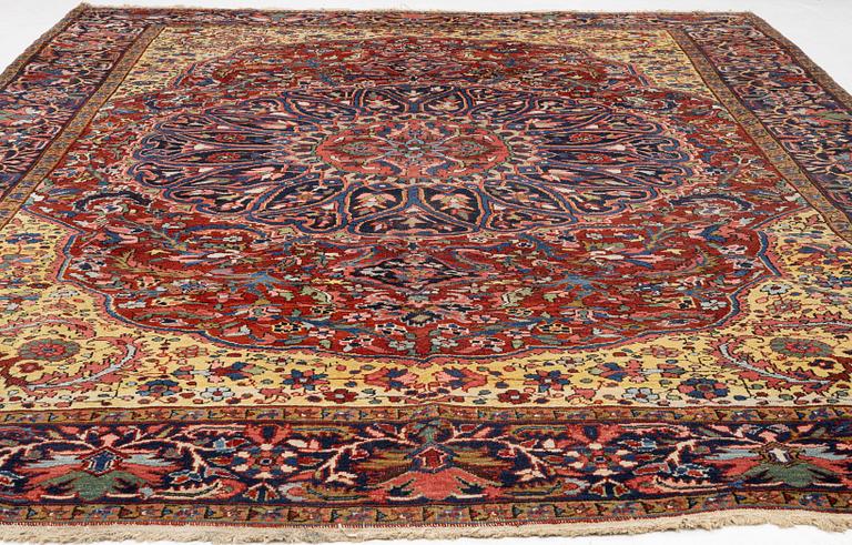 A semi-antique Ahar carpet, c 335 x 275 cm.