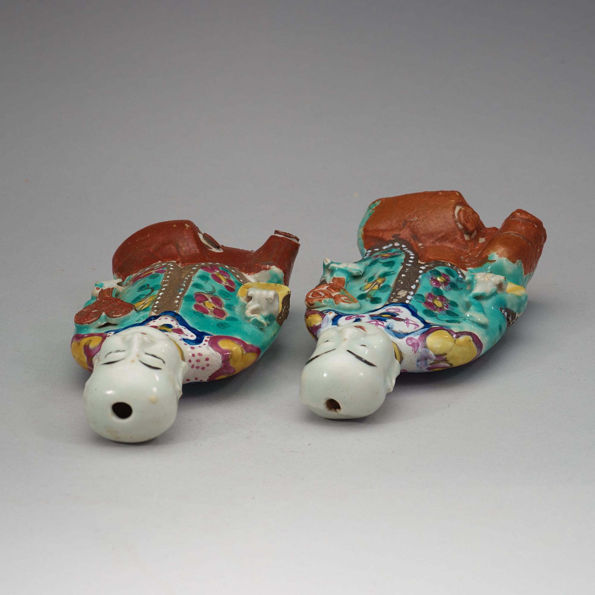 Two famille rose "laughing boys", Qing dynasty, circa 1800.
