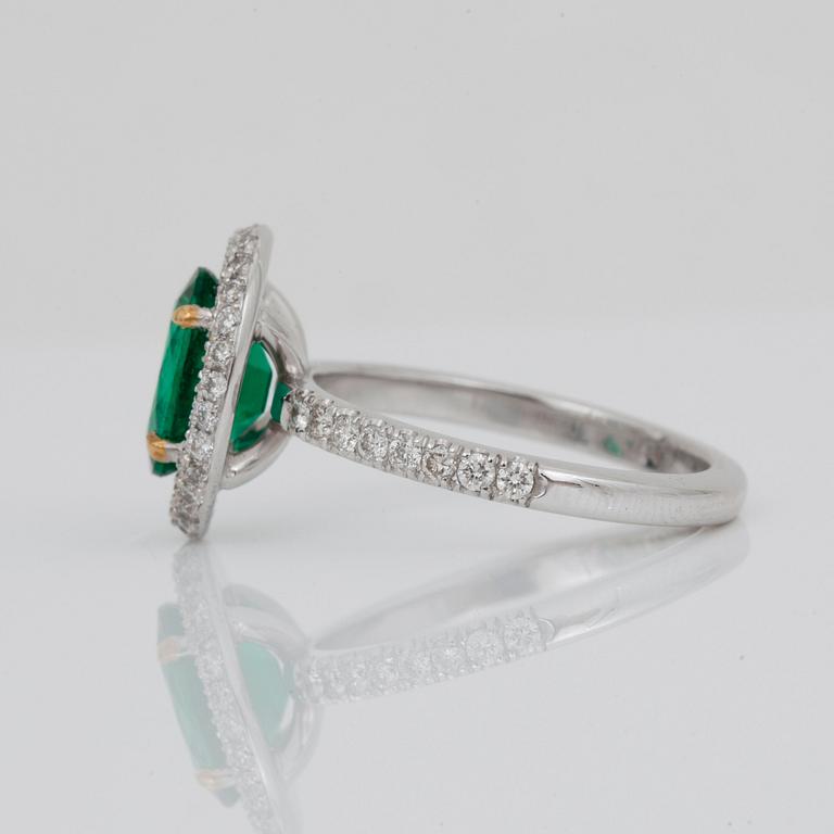 A 1.71-ct Zambian emerald (minor oil) and pavé-set diamond ring. Total carat weight of diamonds 0.65 cts.